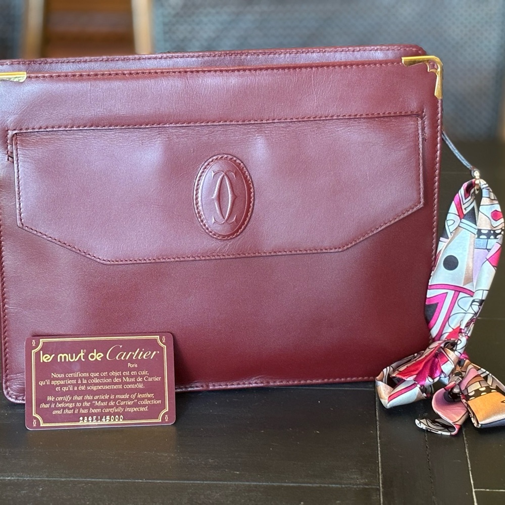 Cartier Burgundy Leather Wristlet Clutch with Gold Corners